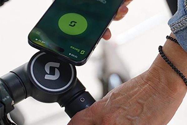Image of a mobile phone being held against the Serea Smartlock
